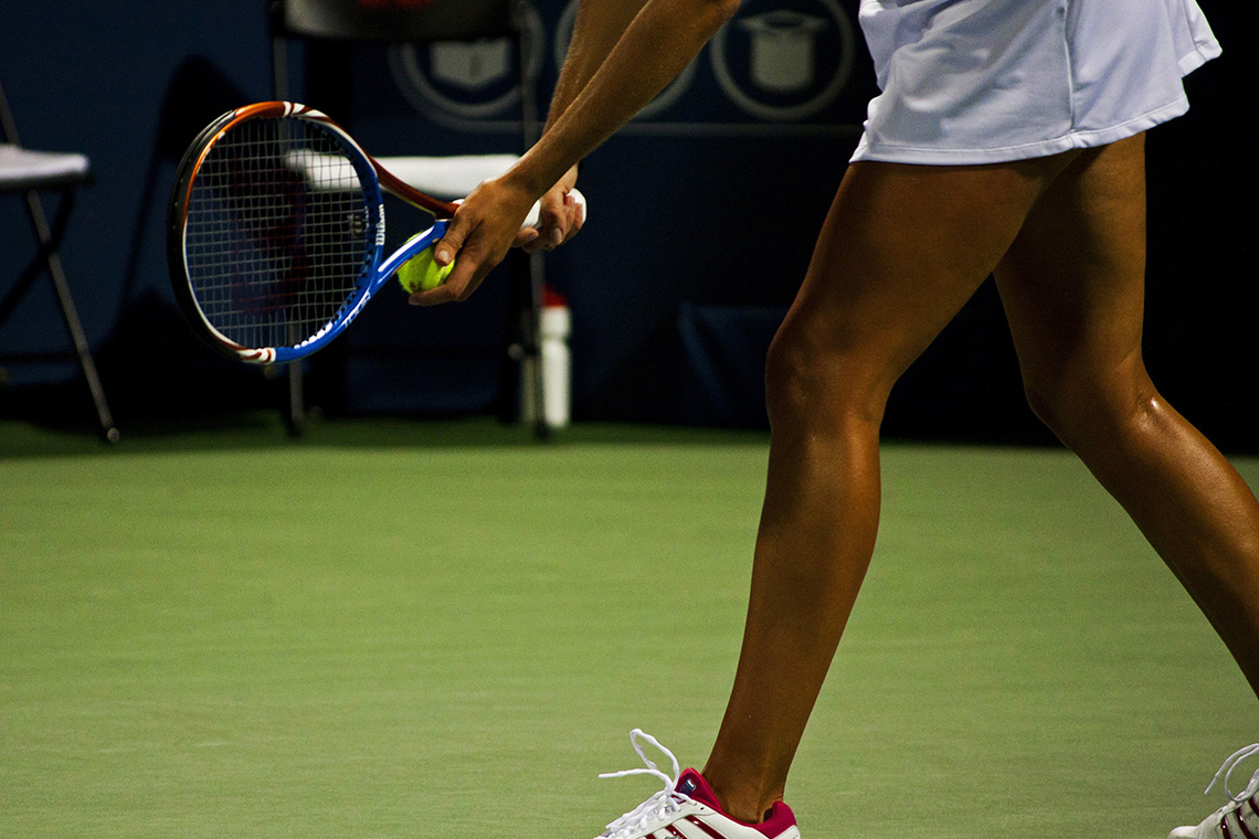 Tennis player preparing to serve